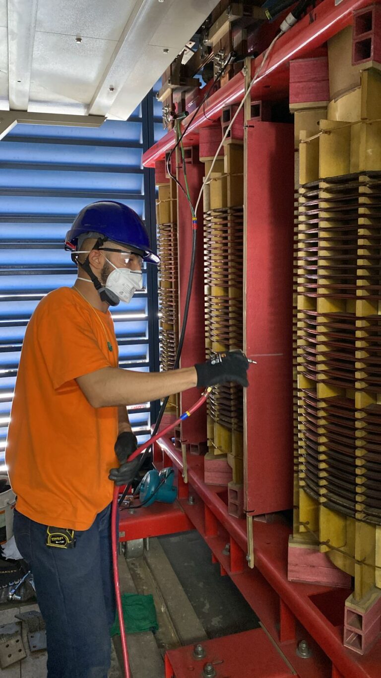 Technician working at heights with fall protection